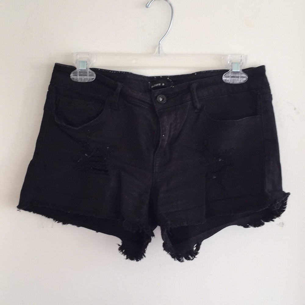 black ripped shorts